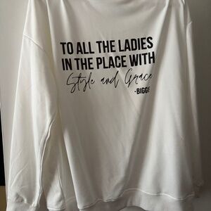 White and Black women sweater